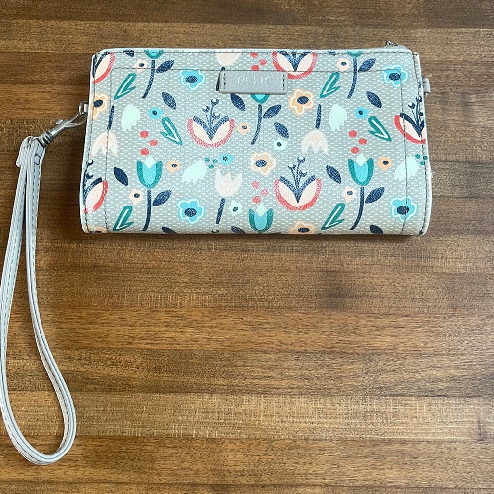 Relic floral wristlet or crossbody wallet snd phone case.